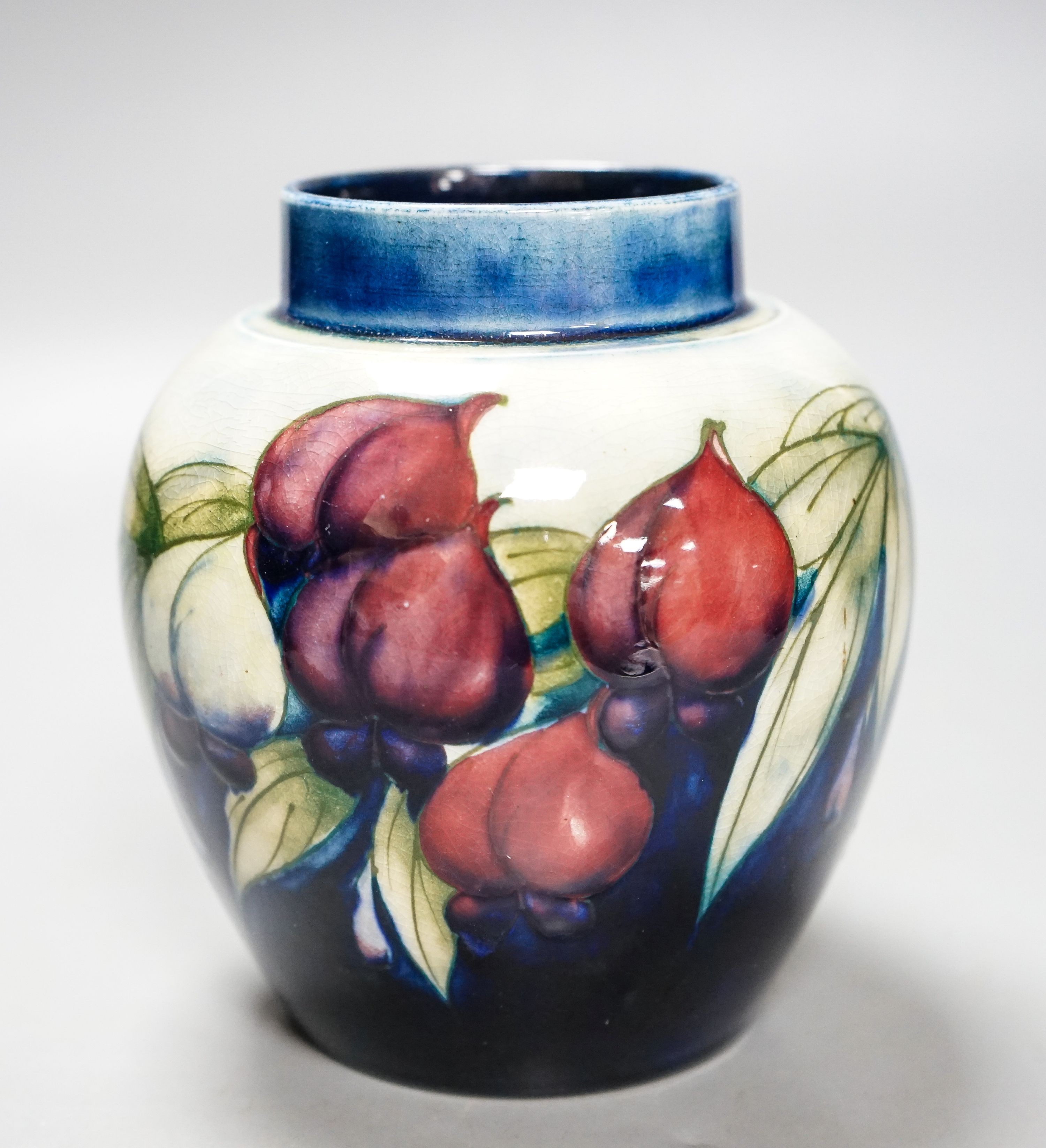 A Moorcroft wisteria pattern jar 13cm